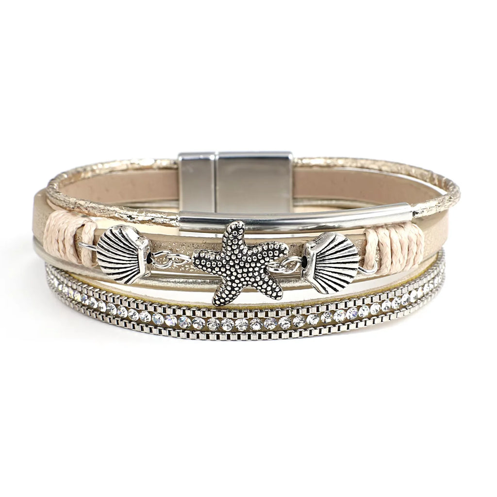 Armband aus Leder mit Muschel und Seestern in Weißgold