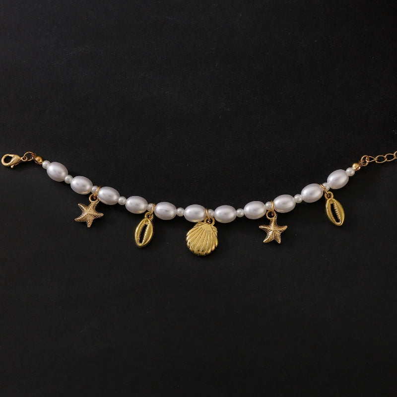 Perlenarmband mit Muscheln