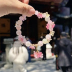 Perlenarmband mit rosa Blumen