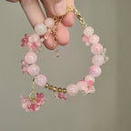 Perlenarmband mit rosa Blumen