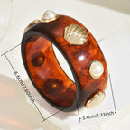 Armband aus Harz mit Muschel
