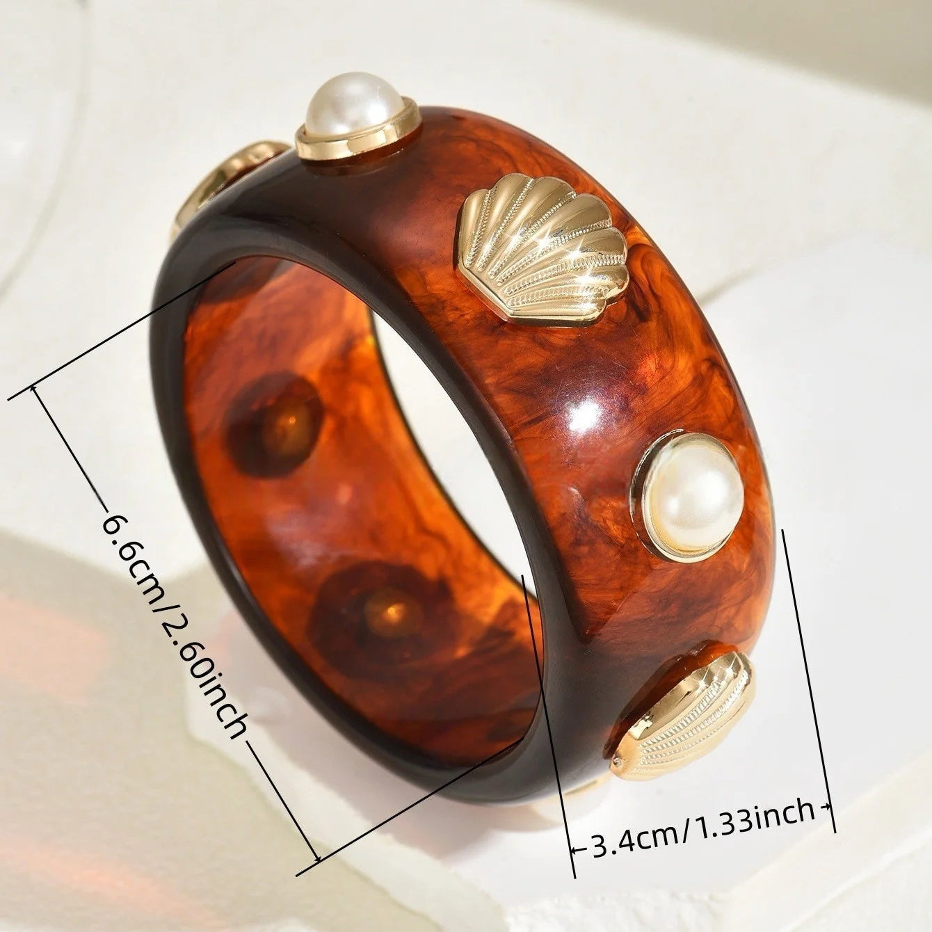 Armband aus Harz mit Muschel