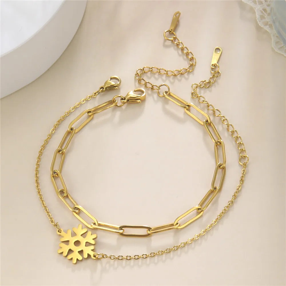 Winter-Doppel-Schneeflocken-Armband Gold