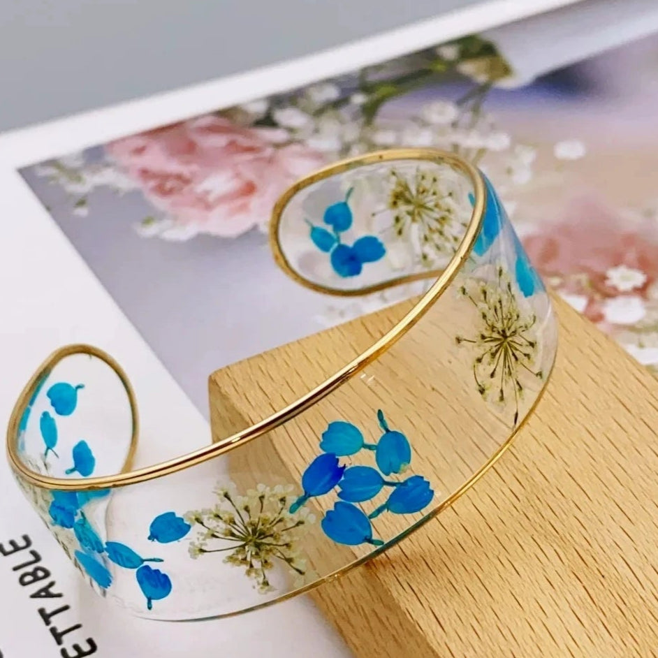 Armband Gourmette Blume aus transparentem blauem Harz a
