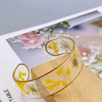 Armband Gourmette Blume aus transparentem gelbem Harz a