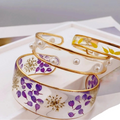 Armband Gourmette Blume aus transparentem violettem Harz A