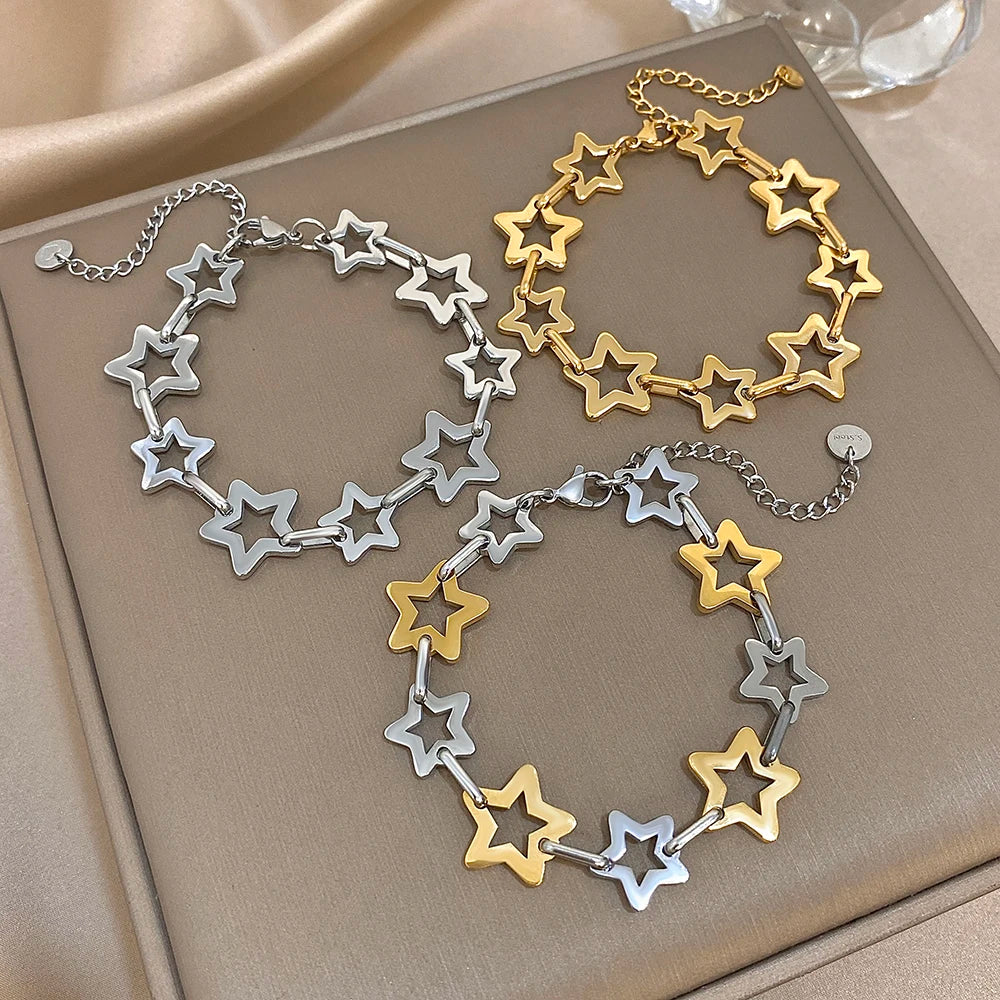 Armband mit mehreren geometrischen Sternen in Gold und Silber