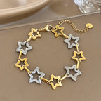 Armband mit mehreren geometrischen Sternen in Gold und Silber