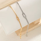Paararmband Verschlungene Knoten Gold und Silber (Set mit 2 Armbändern)