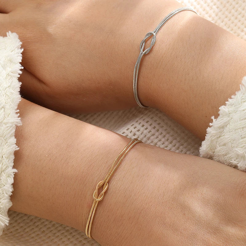 Paararmband Verschlungene Knoten Gold und Silber (Set mit 2 Armbändern)