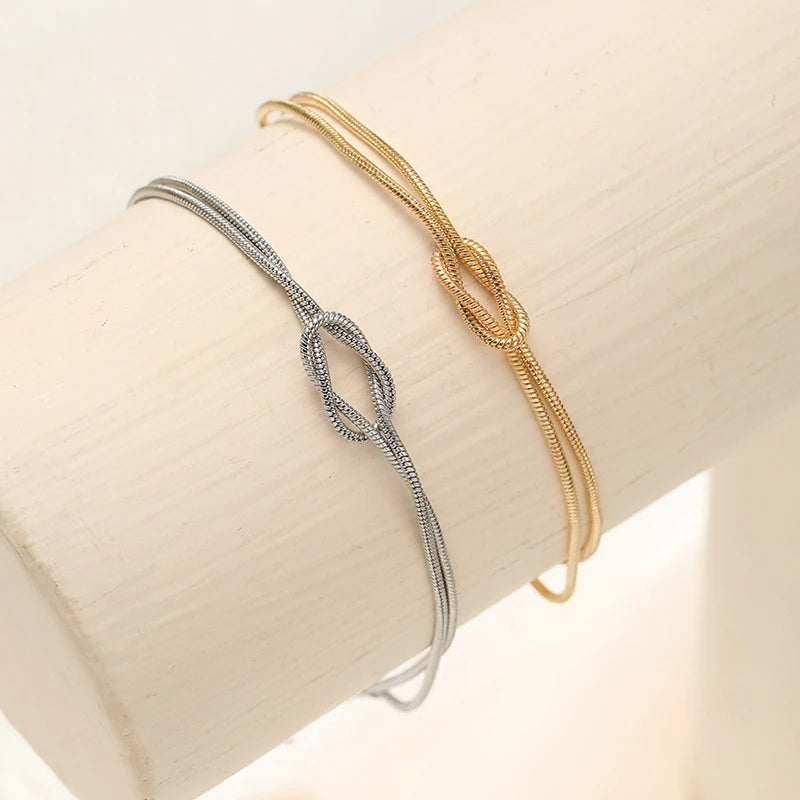 Paararmband Verschlungene Knoten Gold und Silber (Set mit 2 Armbändern)