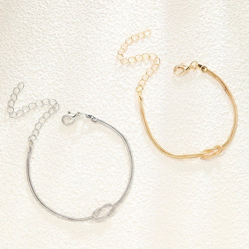 Paararmband Verschlungene Knoten Gold und Silber (Set mit 2 Armbändern)