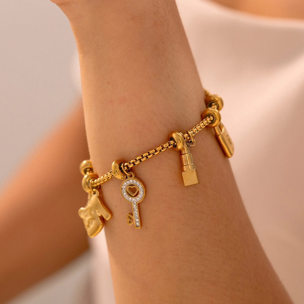 Damenarmband mit Schlüsseln und Schlössern aus Gold