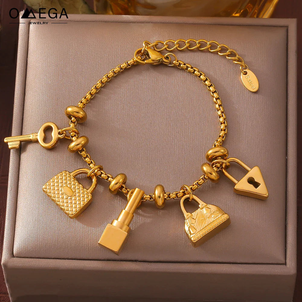 Damenarmband mit Schlüsseln und Schlössern aus Gold