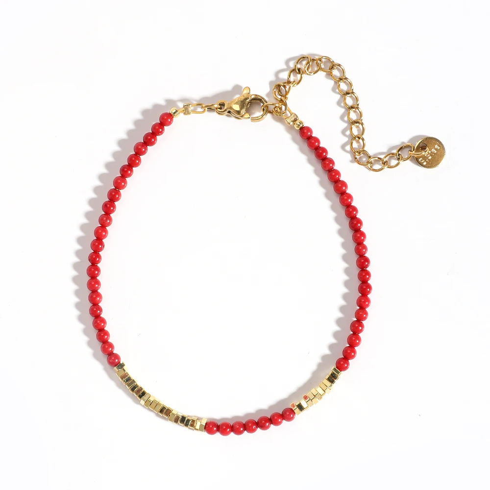 Korallenrotes und goldenes Armband