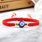 Geflochtenes Armband gegen den bösen Blick Blau Rot und Gold