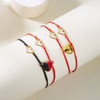 Magnetische Partnerarmbänder mit Herz und EKG in Rot und Rot