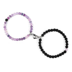 Magnetische Gourmette-Armbänder für Paare mit violetten und schwarzen Perlen