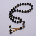 Eleganter muslimischer Rosenkranz - Islamischer Tasbih mit 33 schwarzen und goldenen Perlen