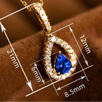 Collana con pendente doppia goccia d'acqua e cristallo blu zaffiro