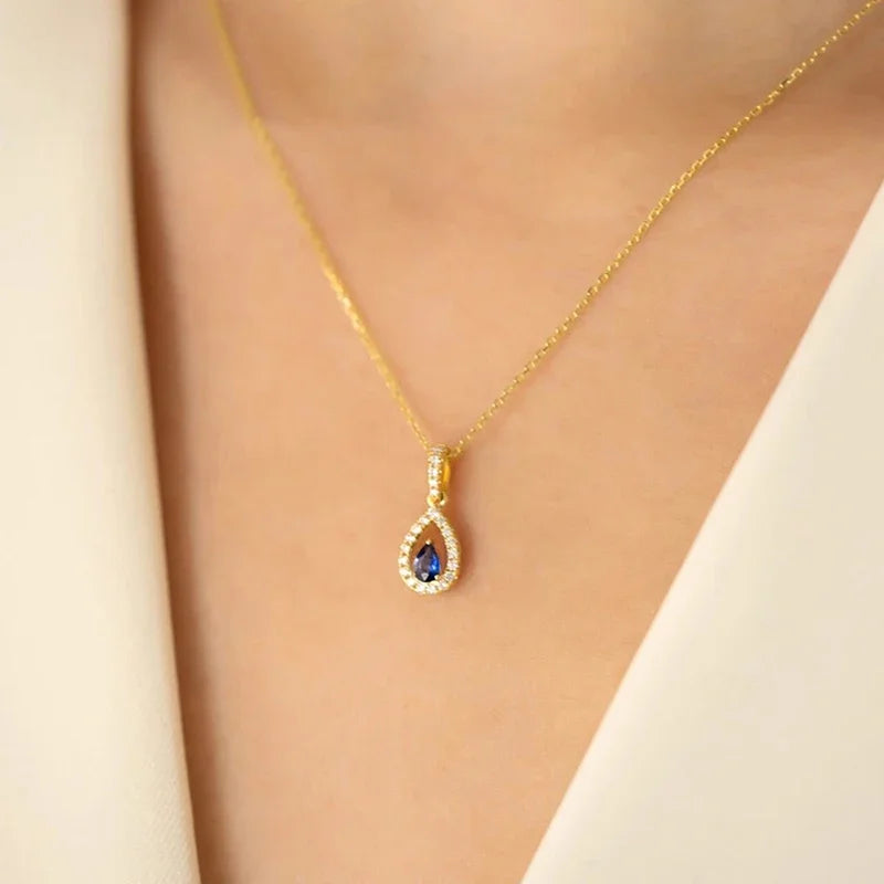 Collana con pendente doppia goccia d'acqua e cristallo blu zaffiro