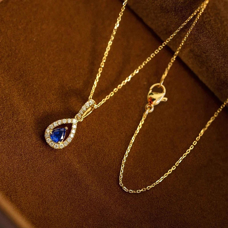 Collana con pendente doppia goccia d'acqua e cristallo blu zaffiro