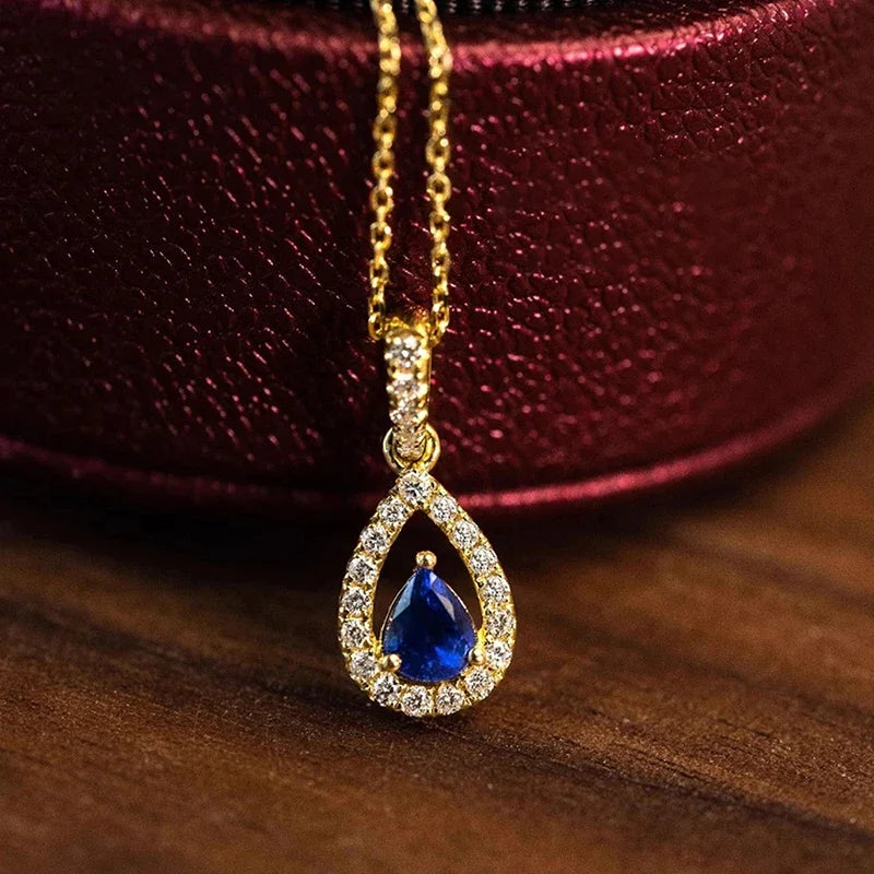 Collana con pendente doppia goccia d'acqua e cristallo blu zaffiro