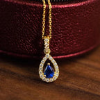 Collana con pendente doppia goccia d'acqua e cristallo blu zaffiro