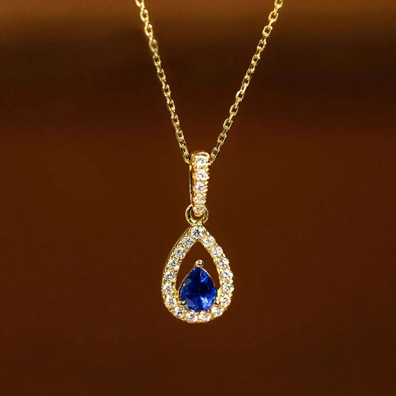 Collana con pendente doppia goccia d'acqua e cristallo blu zaffiro
