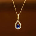 Collana con pendente doppia goccia d'acqua e cristallo blu zaffiro