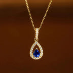 Collana con pendente doppia goccia d'acqua e cristallo blu zaffiro