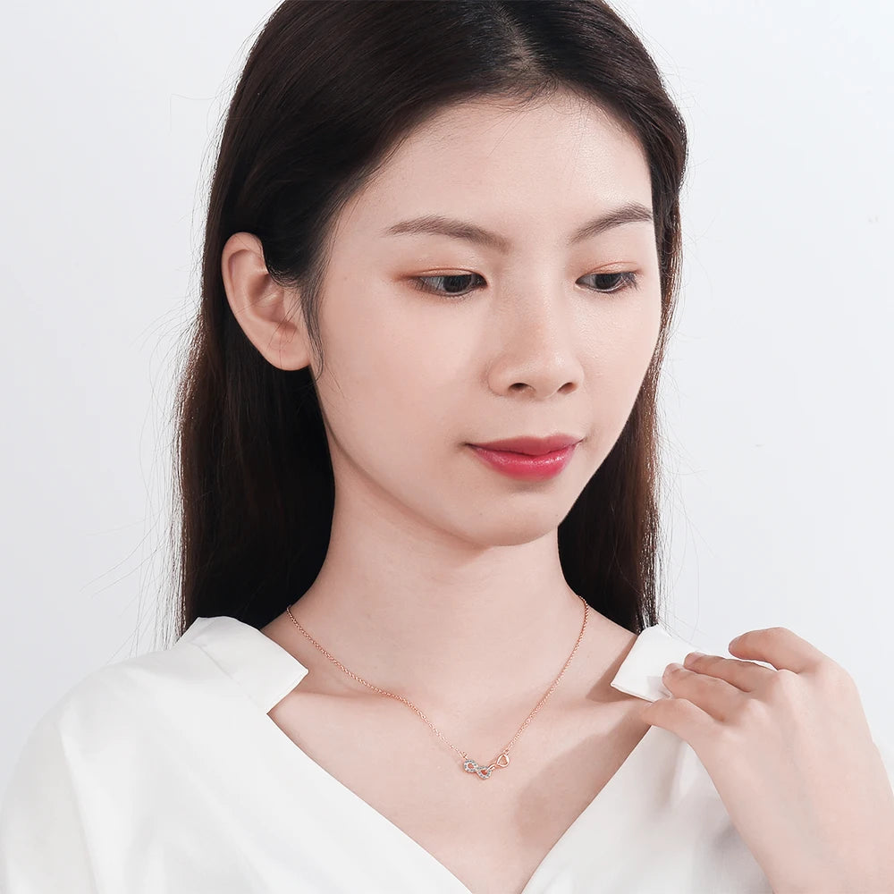 Doppelhalskette mit Unendlichkeitsanhänger und Zirkonia in Roségold