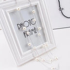 Lange doppelte Halskette mit großen weißen Perlen silber