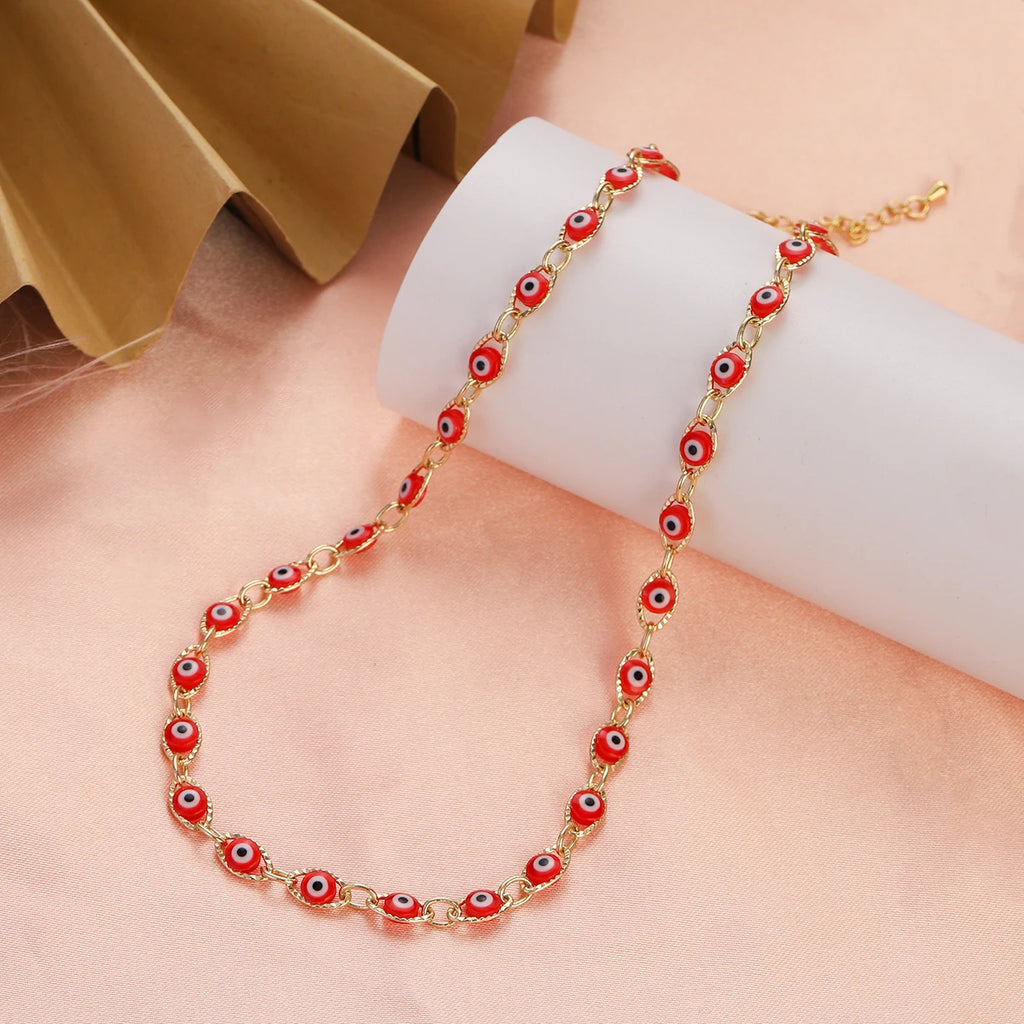 Birden fazla açık kırmızı nazar boncuğu uçlu choker kolye
