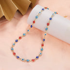 Birden fazla mavi ve kırmızı nazar boncuğu uçlu choker kolye