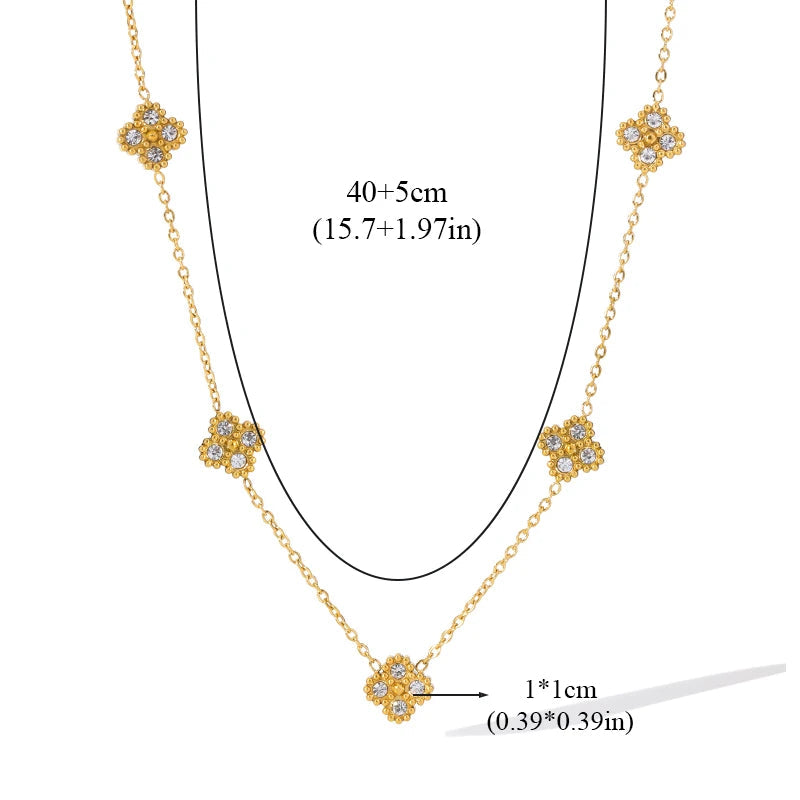Choker mit Anhängern in Form eines vierblättrigen Kleeblatts