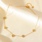 Choker mit Anhängern in Form eines vierblättrigen Kleeblatts