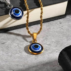 Collana ritorta con discreto pendente occhio blu oro
