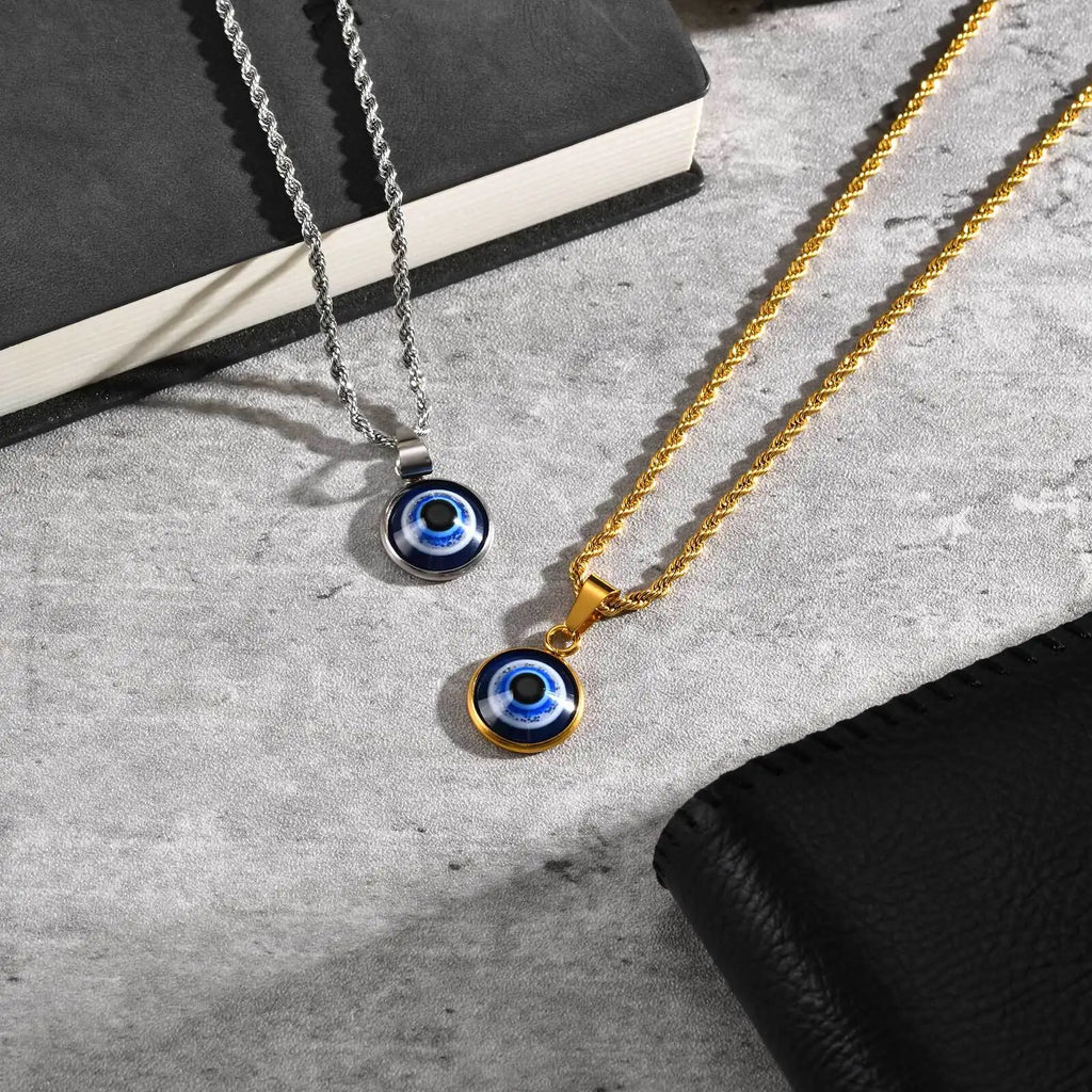 Collana ritorta con discreto pendente occhio blu oro