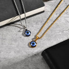 Collana ritorta con discreto pendente occhio blu oro