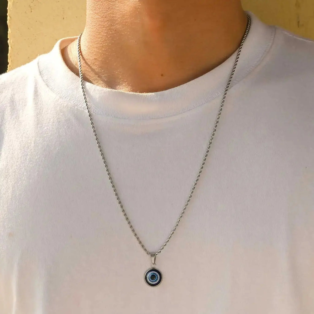 Collana ritorta con discreto pendente occhio blu argento