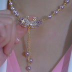 Collier violet à deux cygnes en forme de cœur
