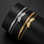 Doppelarmband mit goldenen Engelsflügeln