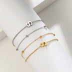 Armband mit doppelter Initiale in Gold und Silber  s