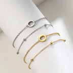Armband mit doppelter Initiale in Gold und Silber  o