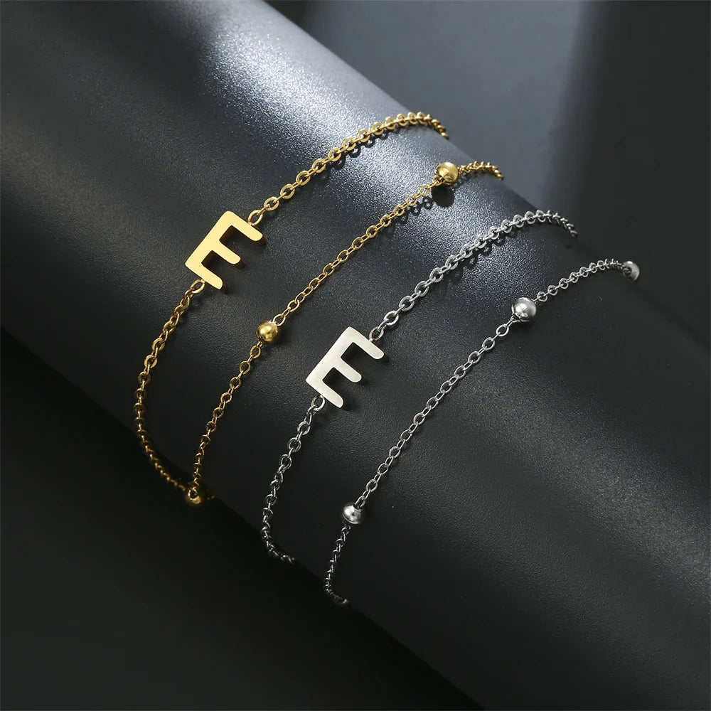 Armband mit doppelter Initiale in Gold und Silber  e