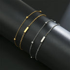 Armband mit doppelter Initiale in Gold und Silber  i