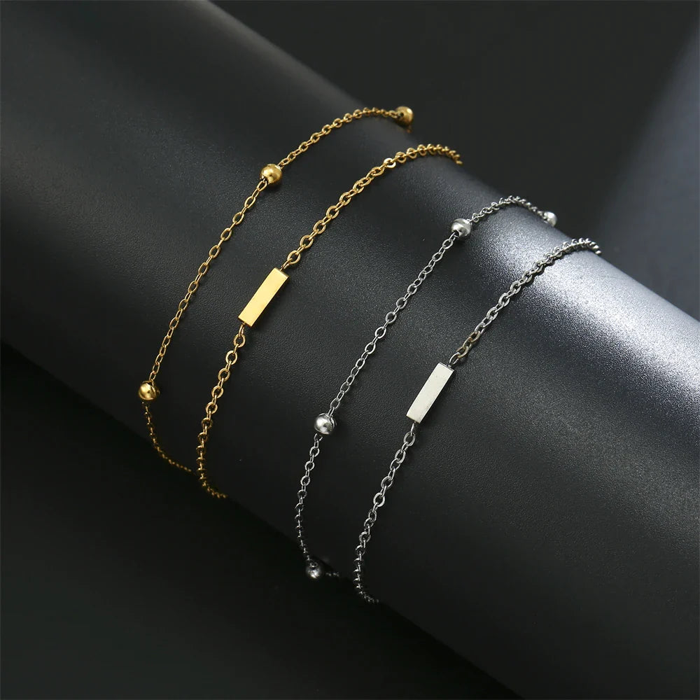 Armband mit doppelter Initiale in Gold und Silber  i
