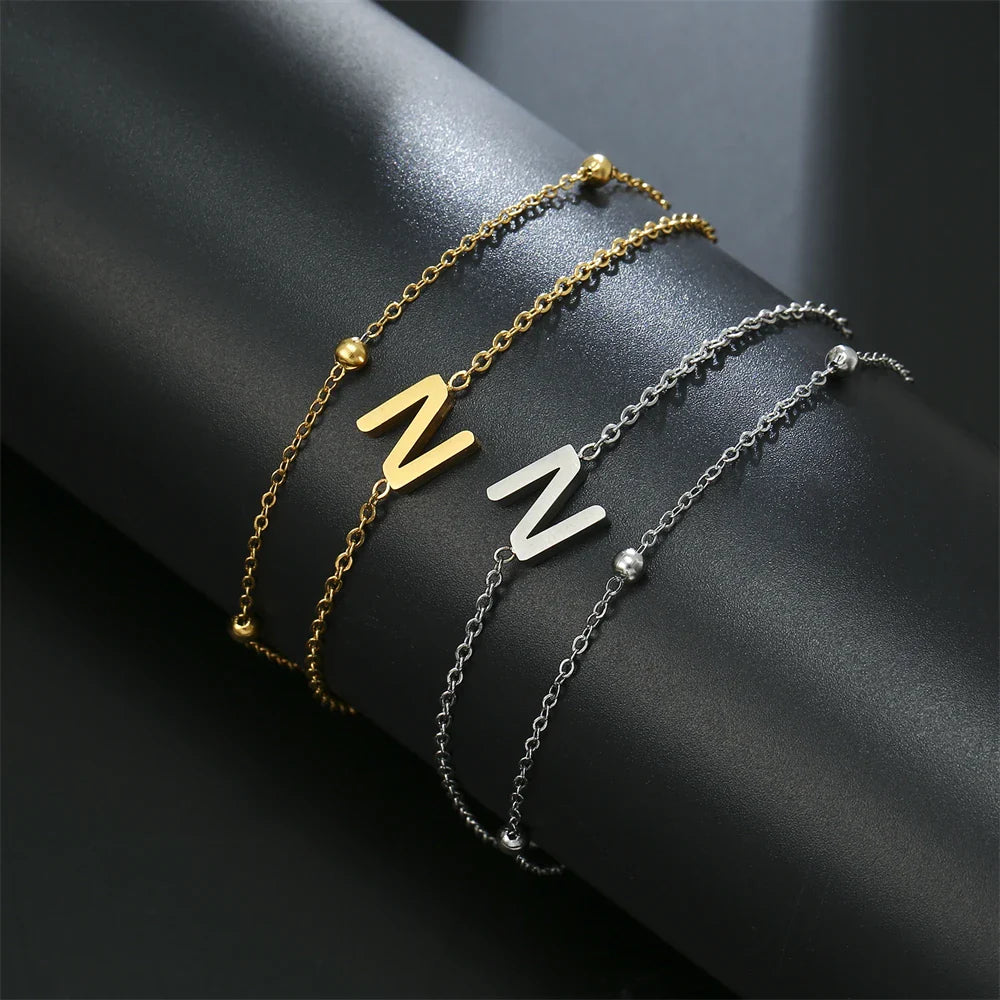Armband mit doppelter Initiale in Gold und Silber  n