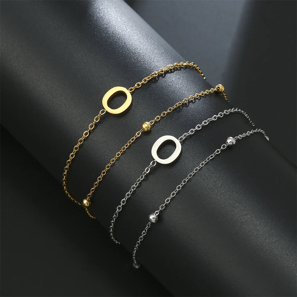 Armband mit doppelter Initiale in Gold und Silber  o
